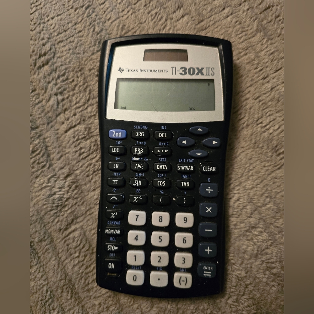 Texas Instraments Tl-30X llS scientific calculator.